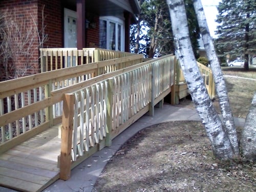 Photograph of a long wooden outdoor ramp built by Adaptive Remodeling Solutions.