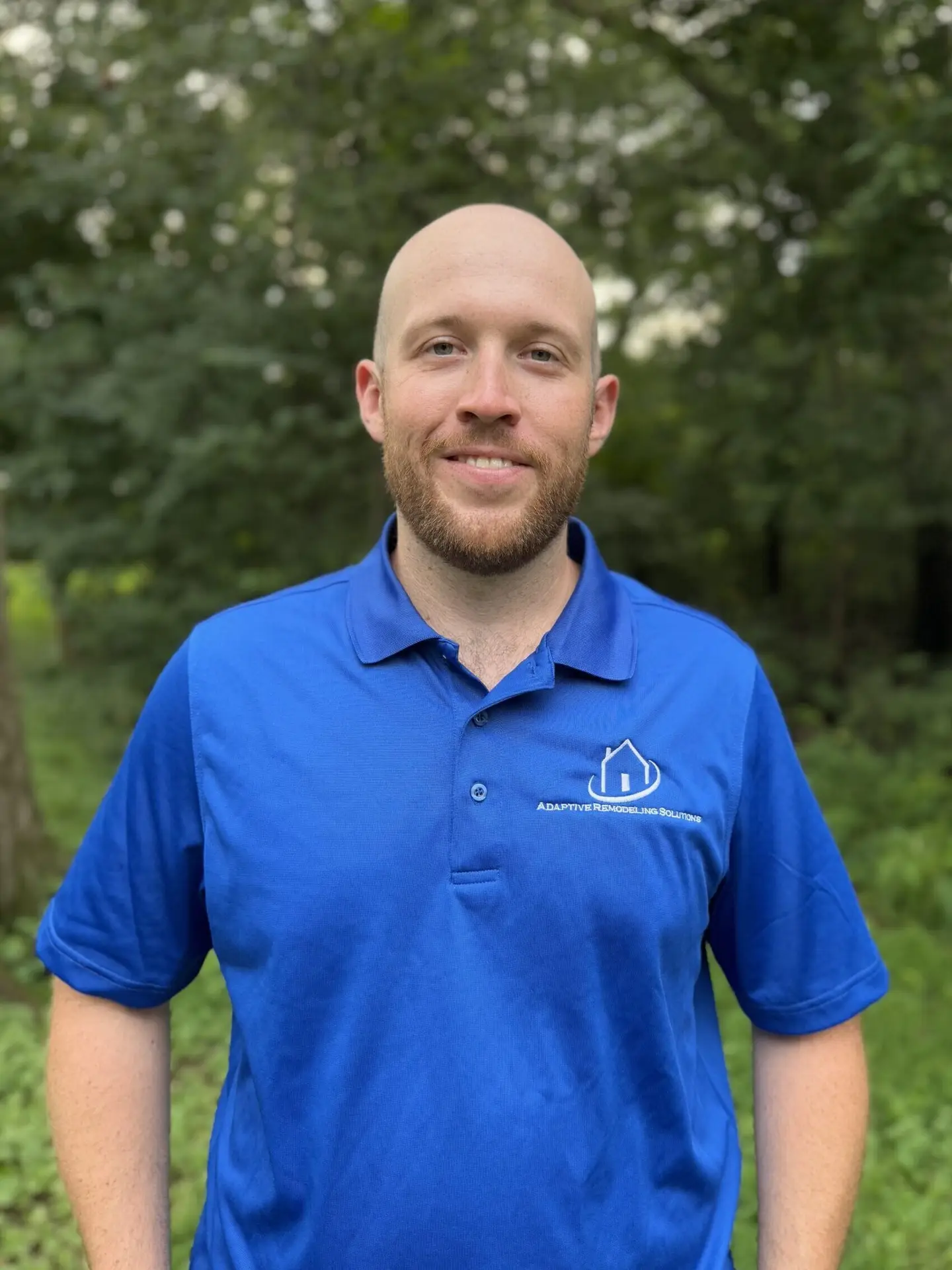 Photograph of Alex Rogers in Adaptive Remodeling Solutions shirt.